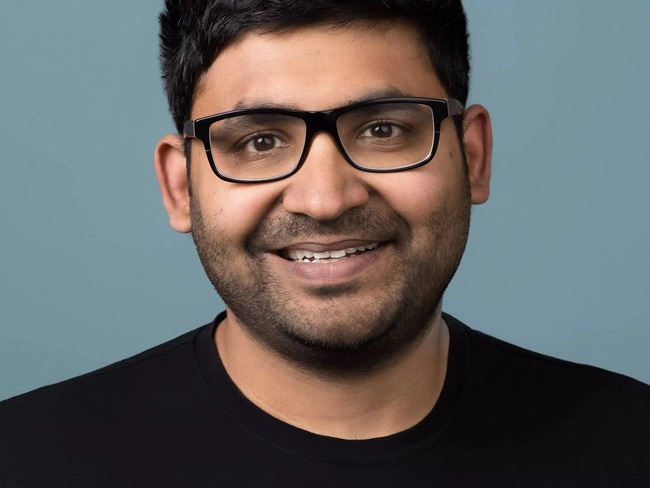 Image of man with with glasses and a black t-shirt